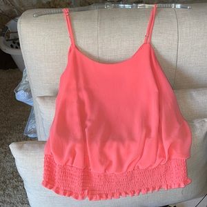 Peach or coral colored cami